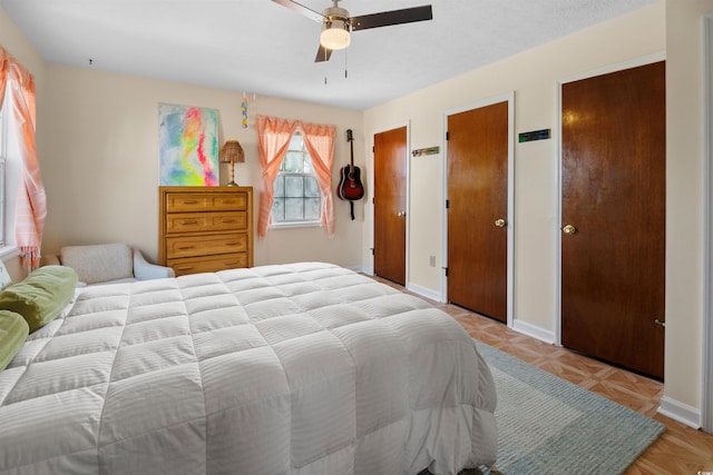 1145 Forest Dr, North Myrtle Beach, SC 29582 - bedroom featuring a ceiling fan and two closets