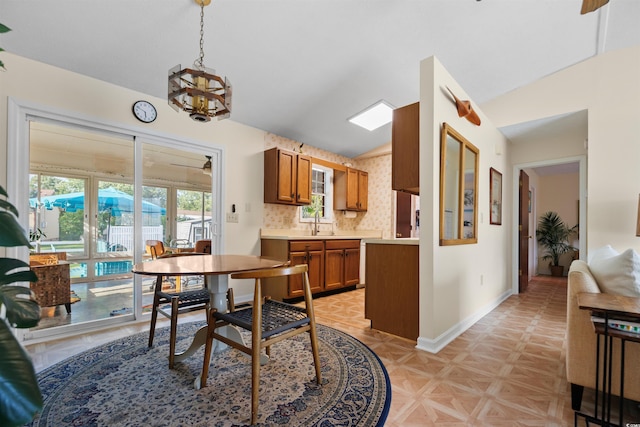 1145 Forest Dr, North Myrtle Beach, SC 29582 - dining area with vaulted ceiling and a chandelier