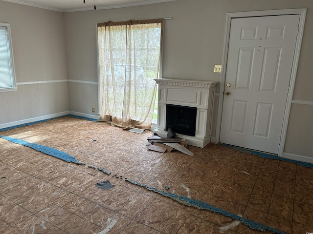 404 E Andrews St, Hemingway, SC 29554 - unfurnished living room with a fireplace with raised hearth and ornamental molding