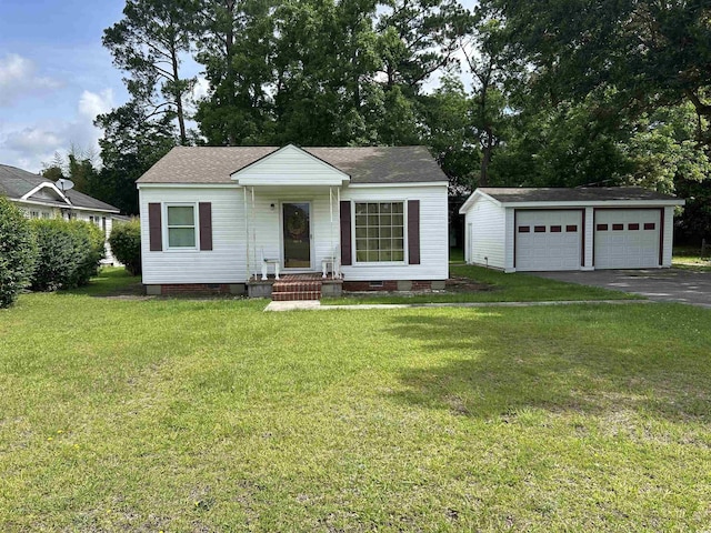 404 E Andrews St, Hemingway, SC 29554 - bungalow featuring an outbuilding, crawl space, a garage, a front lawn, and a shingled roof