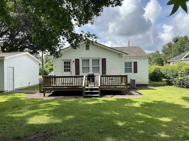 404 E Andrews St, Hemingway, SC 29554 - back of property featuring a yard, a wooden deck, and roof with shingles