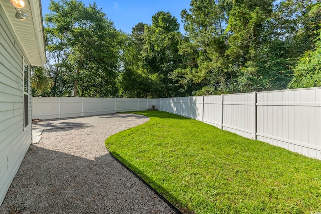1331 Bermuda Ct, Surfside Beach, SC 29575 - fenced backyard with a patio area