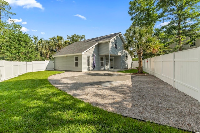 1331 Bermuda Ct, Surfside Beach, SC 29575 - rear view of house featuring a fenced backyard and a patio area