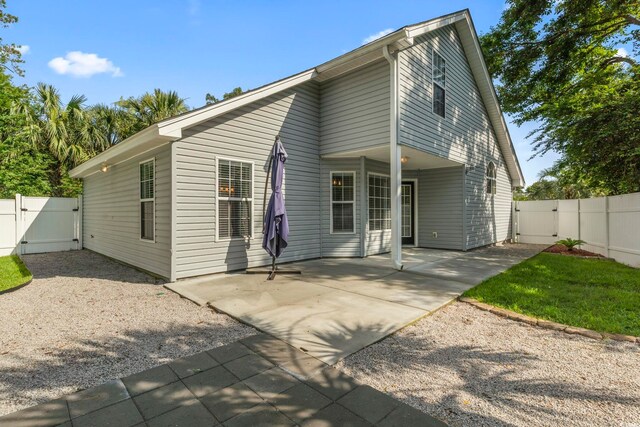 1331 Bermuda Ct, Surfside Beach, SC 29575 - back of house with a gate, a fenced backyard, and a patio