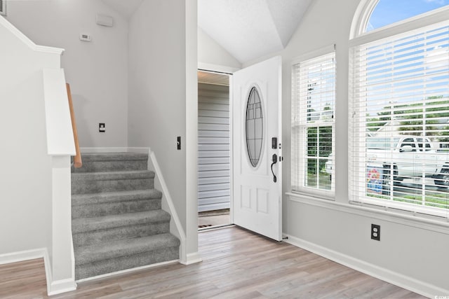 1331 Bermuda Ct, Surfside Beach, SC 29575 - foyer featuring lofted ceiling, stairs, and wood finished floors