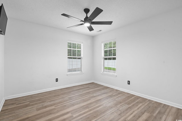 1331 Bermuda Ct, Surfside Beach, SC 29575 - unfurnished room with wood finished floors, a textured ceiling, and ceiling fan