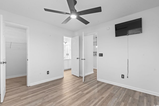 1331 Bermuda Ct, Surfside Beach, SC 29575 - unfurnished bedroom with light wood-style flooring, a walk in closet, a closet, and ensuite bathroom