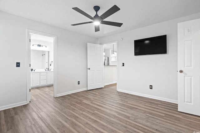 1331 Bermuda Ct, Surfside Beach, SC 29575 - unfurnished bedroom with wood finished floors, stainless steel fridge, connected bathroom, and ceiling fan