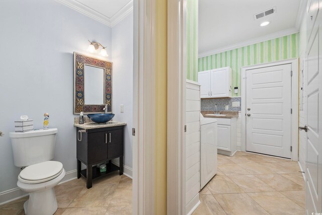28 Grey Moss Rd, Murrells Inlet, SC 29576 - bathroom featuring ornamental molding, vanity, and washer / dryer