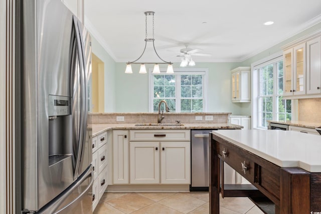 28 Grey Moss Rd, Murrells Inlet, SC 29576 - kitchen with appliances with stainless steel finishes, crown molding, a ceiling fan, glass insert cabinets, and light tile patterned flooring