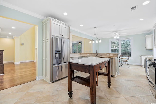 28 Grey Moss Rd, Murrells Inlet, SC 29576 - kitchen featuring stainless steel fridge, a peninsula, ceiling fan, crown molding, and recessed lighting