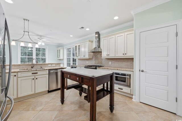28 Grey Moss Rd, Murrells Inlet, SC 29576 - kitchen with appliances with stainless steel finishes, wall chimney range hood, decorative backsplash, ornamental molding, and light tile patterned floors