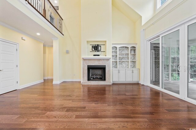 28 Grey Moss Rd, Murrells Inlet, SC 29576 - unfurnished living room with a high ceiling, wood finished floors, and a premium fireplace
