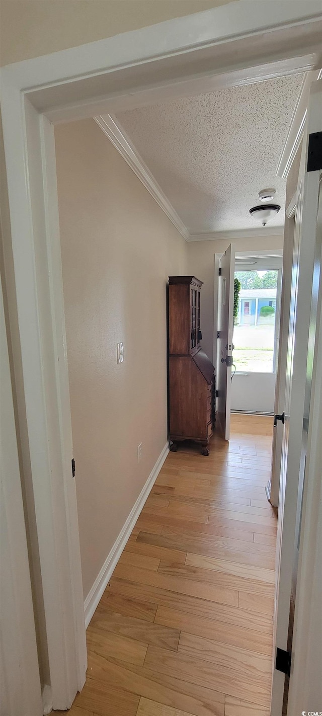 610 Hibiscus Ave Unit 610, Myrtle Beach, SC 29572 - hall featuring light wood-style floors, crown molding, and a textured ceiling