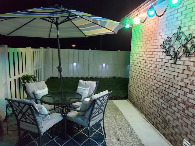 610 Hibiscus Ave Unit 610, Myrtle Beach, SC 29572 - patio at night featuring outdoor dining space