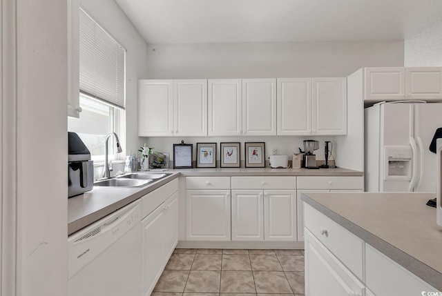 1208 Trisail Ln, North Myrtle Beach, SC 29582 - kitchen with white appliances, light countertops, and white cabinetry