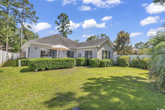 1208 Trisail Ln, North Myrtle Beach, SC 29582 - rear view of house with stucco siding