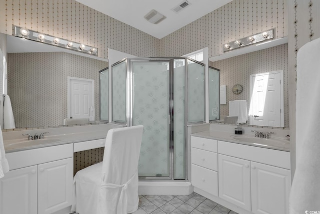 1208 Trisail Ln, North Myrtle Beach, SC 29582 - bathroom with wallpapered walls, tile patterned flooring, a stall shower, and two vanities
