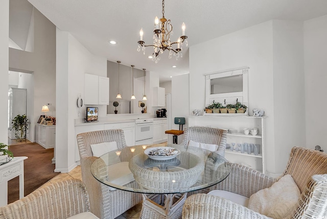 1208 Trisail Ln, North Myrtle Beach, SC 29582 - dining area featuring a chandelier, recessed lighting, and a high ceiling
