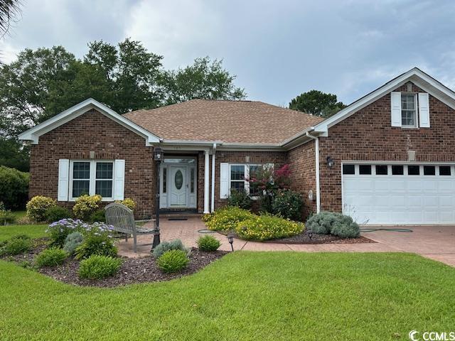 105 Ashley River Rd, Myrtle Beach, SC 29588 - ranch-style home featuring a front lawn, brick siding, driveway, and roof with shingles