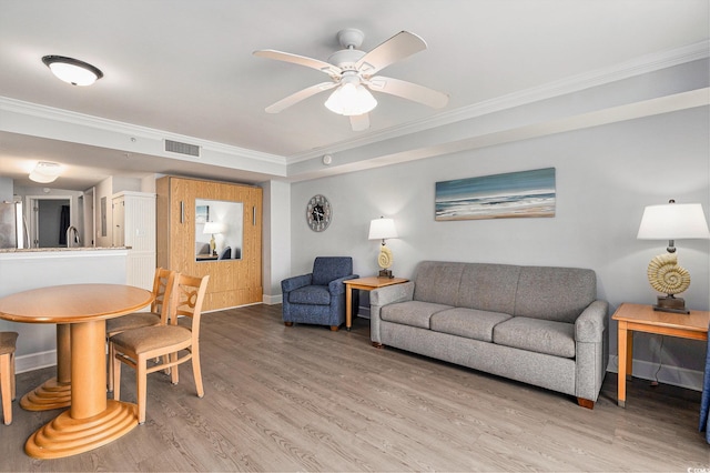 2201 S Ocean Blvd Unit 103, Myrtle Beach, SC 29577 - living room featuring crown molding, ceiling fan, and light wood finished floors