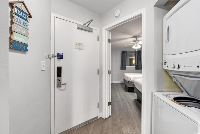 2201 S Ocean Blvd Unit 103, Myrtle Beach, SC 29577 - hallway featuring stacked washer / drying machine and wood finished floors