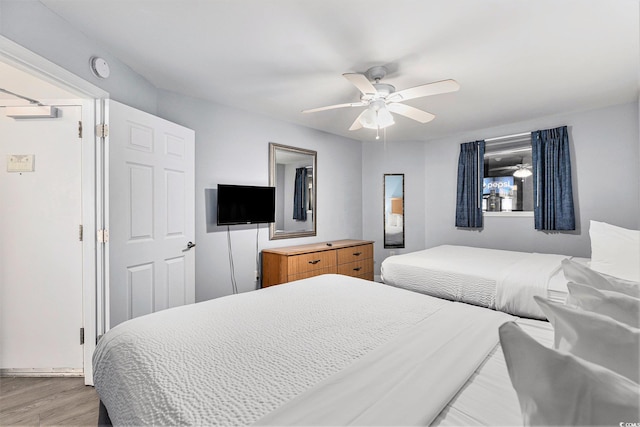 2201 S Ocean Blvd Unit 103, Myrtle Beach, SC 29577 - bedroom featuring light wood-type flooring and a ceiling fan