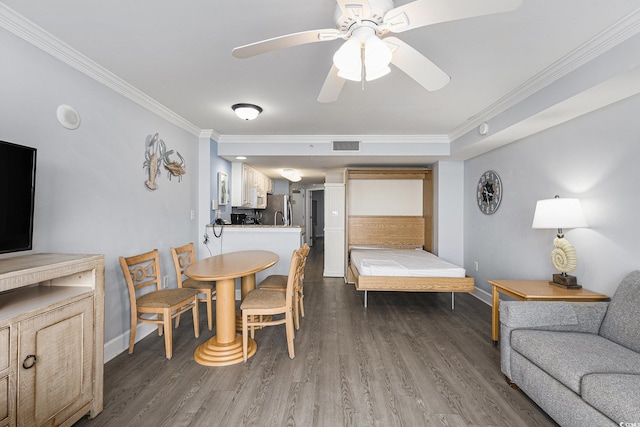 2201 S Ocean Blvd Unit 103, Myrtle Beach, SC 29577 - dining space featuring ornamental molding, dark wood-type flooring, and ceiling fan