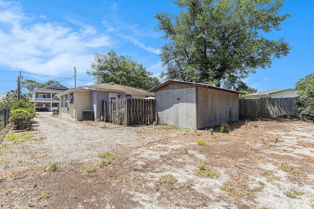 1416 Edge Dr, North Myrtle Beach, SC 29582 - back of property with a fenced backyard and a storage shed