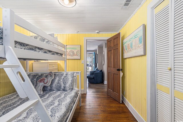 1416 Edge Dr, North Myrtle Beach, SC 29582 - bedroom featuring wood-type flooring, wooden walls, and a closet