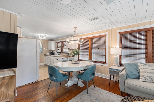 1416 Edge Dr, North Myrtle Beach, SC 29582 - dining space featuring a chandelier, hardwood / wood-style flooring, and wooden ceiling