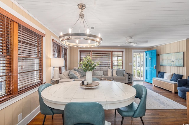 1416 Edge Dr, North Myrtle Beach, SC 29582 - dining area featuring wood finished floors, wood walls, a chandelier, ceiling fan, and crown molding