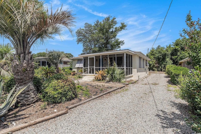 1416 Edge Dr, North Myrtle Beach, SC 29582 - back of property featuring a sunroom and stucco siding