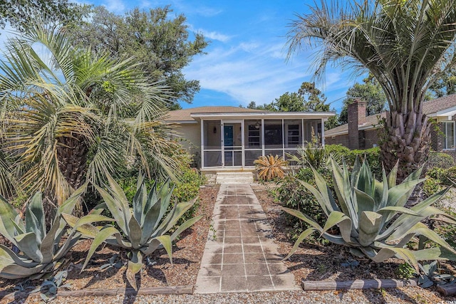 1416 Edge Dr, North Myrtle Beach, SC 29582 - back of property featuring a sunroom and stucco siding