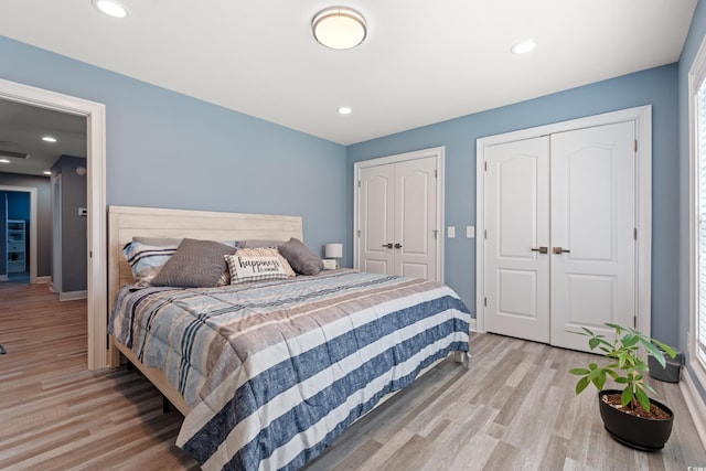 2885 Desert Rose St, Little River, SC 29566 - bedroom featuring multiple closets, light wood-style floors, and recessed lighting