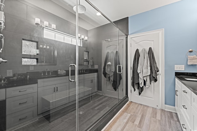 2885 Desert Rose St, Little River, SC 29566 - bathroom with vanity, a shower stall, and wood finished floors