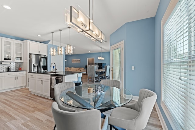 2885 Desert Rose St, Little River, SC 29566 - dining space with light wood-style floors, a chandelier, and recessed lighting