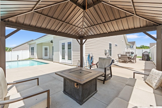 2885 Desert Rose St, Little River, SC 29566 - fenced backyard featuring french doors, a patio area, outdoor dining area, and an outdoor living space
