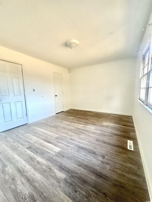 1025 Carolina Rd Unit H4, Conway, SC 29526 - unfurnished bedroom featuring wood finished floors and a textured ceiling