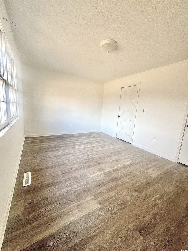1025 Carolina Rd Unit H4, Conway, SC 29526 - unfurnished room featuring wood finished floors and a textured ceiling