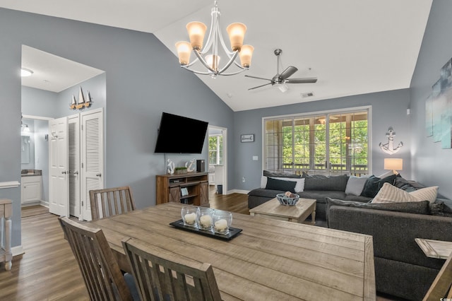 6015 Catalina Dr Unit 932, North Myrtle Beach, SC 29582 - dining space featuring a chandelier, vaulted ceiling, ceiling fan, and wood finished floors