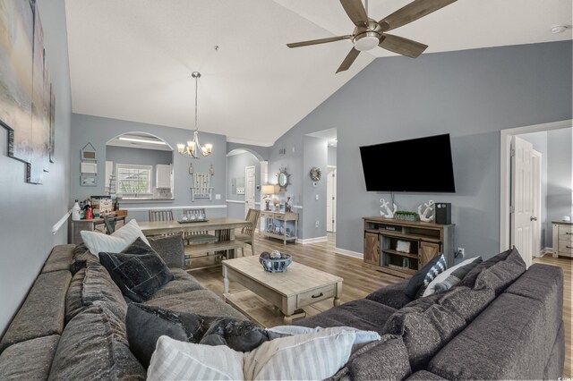 6015 Catalina Dr Unit 932, North Myrtle Beach, SC 29582 - living area with arched walkways, wood finished floors, a ceiling fan, a chandelier, and high vaulted ceiling