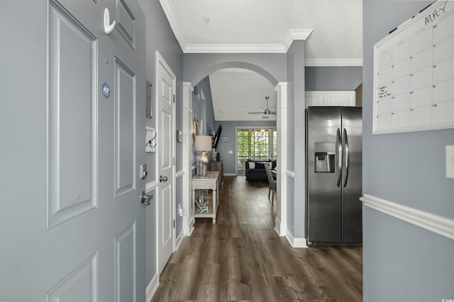 6015 Catalina Dr Unit 932, North Myrtle Beach, SC 29582 - entrance foyer with dark wood finished floors, a ceiling fan, arched walkways, ornamental molding, and a textured ceiling