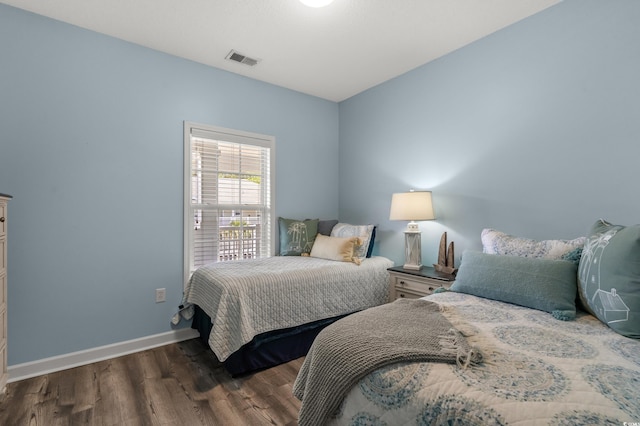 6015 Catalina Dr Unit 932, North Myrtle Beach, SC 29582 - bedroom featuring wood finished floors and baseboards