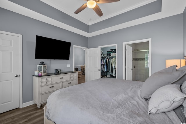 6015 Catalina Dr Unit 932, North Myrtle Beach, SC 29582 - bedroom featuring ornamental molding, dark wood-style flooring, a spacious closet, a closet, and connected bathroom