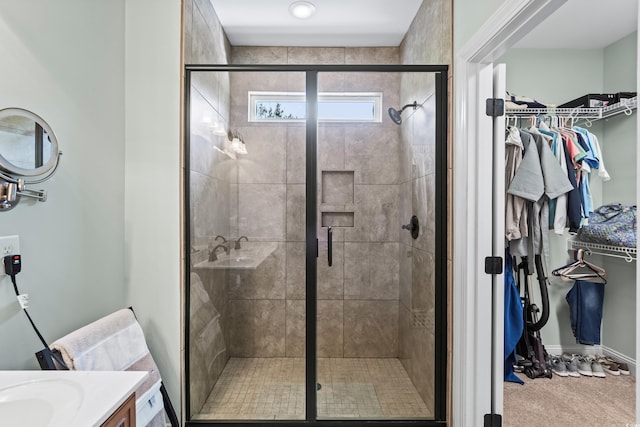 5 Ruth St, Murrells Inlet, SC 29576 - full bath with vanity, a walk in closet, and a stall shower