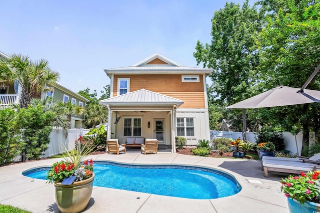5 Ruth St, Murrells Inlet, SC 29576 - rear view of house with ceiling fan, an outdoor living space, a patio area, a fenced backyard, and a metal roof