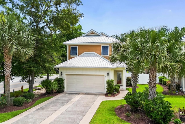 5 Ruth St, Murrells Inlet, SC 29576 - view of front of home featuring driveway, a metal roof, and a garage
