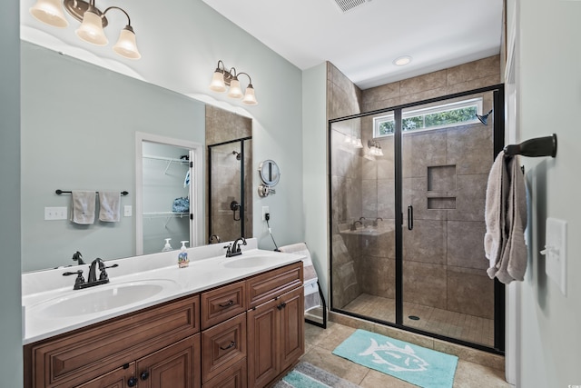 5 Ruth St, Murrells Inlet, SC 29576 - full bathroom with a shower stall, double vanity, a walk in closet, and tile patterned flooring