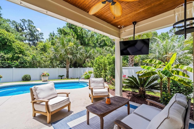 5 Ruth St, Murrells Inlet, SC 29576 - fenced backyard featuring a ceiling fan, a patio area, and an outdoor hangout area